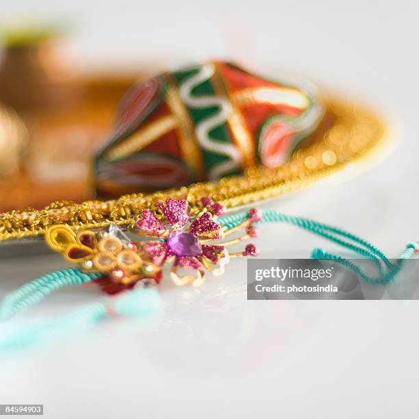 close-up of a rakhi with a rakhi thali - akhi stock pictures, royalty-free photos & images