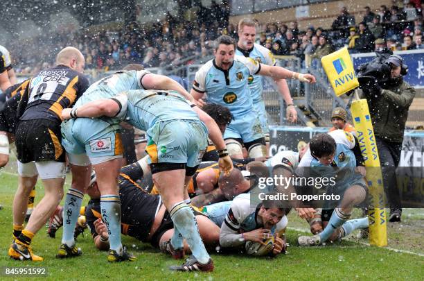 Lee Dickson of Northampton Saints scores his team's second try during the Aviva Premiership match between London Wasps and Northampton Saints at...