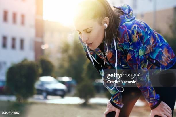 exhausted female runner - tough stock pictures, royalty-free photos & images