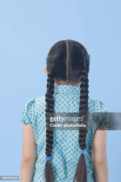 rear view of a girl standing - hair parting stock pictures, royalty-free photos & images