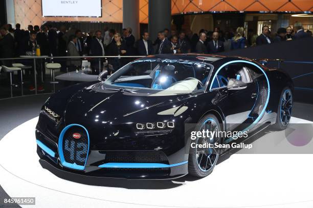 Visitors look at the new Bugatti Chiron at the 2017 Frankfurt Auto Show on September 12, 2017 in Frankfurt am Main, Germany. The Frankfurt Auto Show...