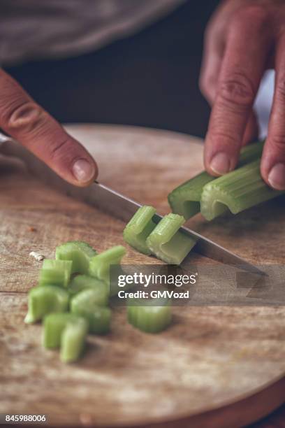 cutting fresh celery - celery sticks stock pictures, royalty-free photos & images