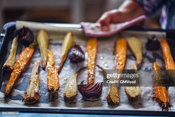 roasted root vegetables fresh from the oven - roasted imagens e fotografias de stock