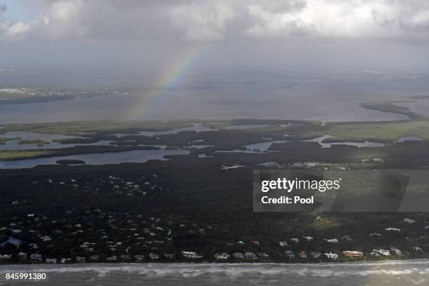 Rainbow appears above damaged houses in the aftermath of Hurricane Irma on September 11, 2017 over the Florida Keys, Florida