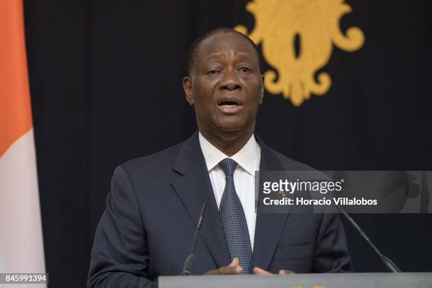 The President of Ivory Coast Alassane Dramane Ouattara delivers remarks to the press at the end of his meeting with Portuguese President Marcelo...