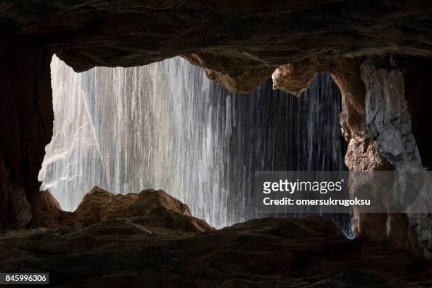 view of the waterfall from the cave inside in valencia, spain - vanishing spray imagens e fotografias de stock