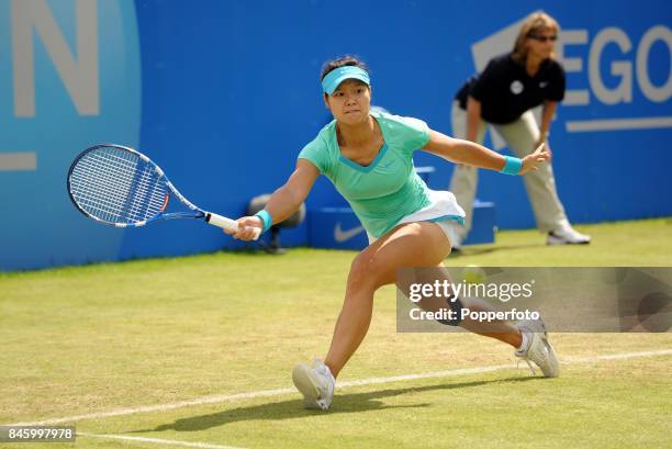 Li Na of China in action against Maria Sharapova of Russia in the Women's Singles final during the AEGON Classic Tennis Championships at the...