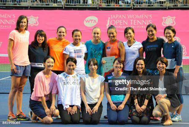 Kimiko Date of Japan poses after the retirement ceremony after her singles first round match against Aleksandra Krunic of Serbia during day two of...