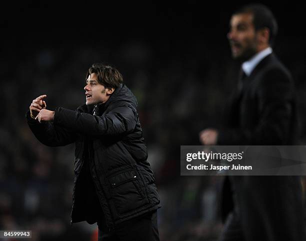 Coach Mauricio Roberto Pochettino of Espanyol gestures to his players flanked by coach Josep Guardiola of Barcelona during the Copa del Rey quarter...