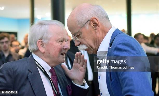 Dieter Zetsche , Chairman of Daimler AG, speaks with Wolfgang Porsche before the Mercedes-Benz press conference at the 2017 Frankfurt Auto Show on...