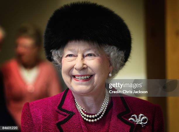 Queen Elizabeth II laughs as she is taken on a tour of the Carole Brown Health Centre on February 3, 2009 in Dersingham, England. The Queen attended...