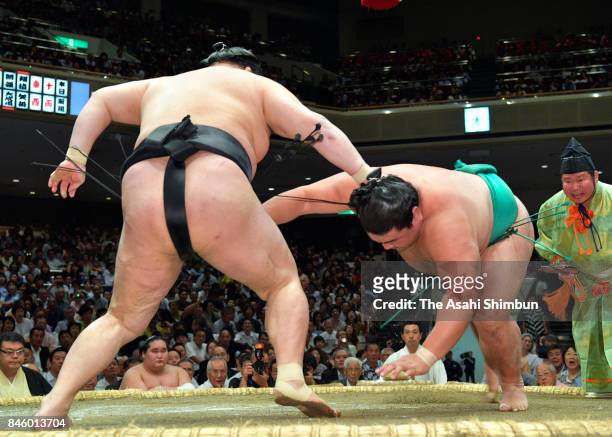 Ozeki Goeido throws sekiwake Yoshikaze to win during day three of the Grand Sumo Autumn Tournament at Ryogoku Kokugikan on September 12, 2017 in...
