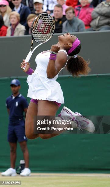 Serena Williams of the USA celebrates her fourth round victory over Yaroslava Shvedova of Kazakhstan on Day Seven of the Wimbledon Lawn Tennis...