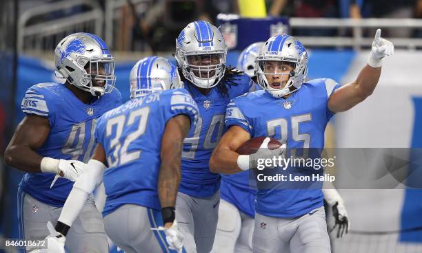 Miles Killebrew of the Detroit Lions celebrates a touchdown after making the interception during the fourth quarter of the game against the Arizona...