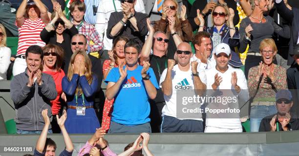 Andy Murray's wife Kim Sears and mother Judy Murray celebrate with family and friends after Murray wins his semi final match against Jo-Wilfried...
