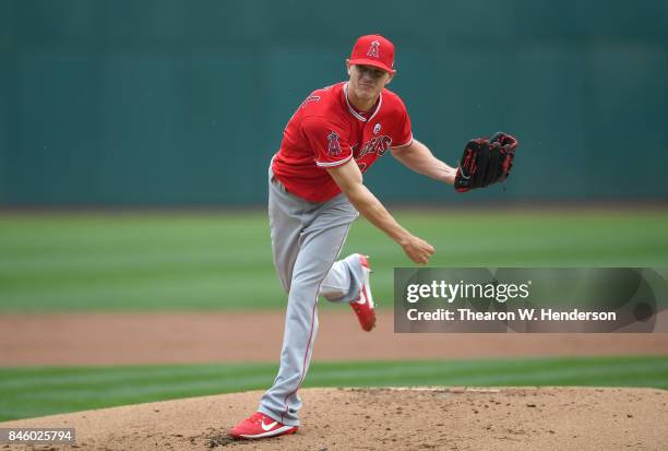 Parker Bridwell of the Los Angeles Angels of Anaheim pitches against the Oakland Athletics in the bottom of the first inning at Oakland Alameda...