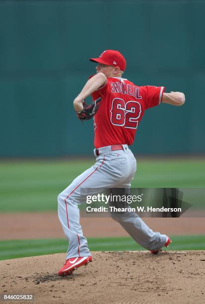 Parker Bridwell of the Los Angeles Angels of Anaheim pitches against the Oakland Athletics in the bottom of the first inning at Oakland Alameda...