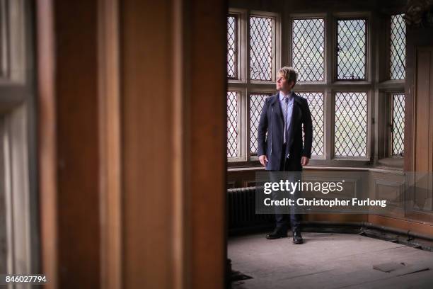 Film actor Hopwood DePree XIV stands inside Hopwood Hall, his family's ancestral home, that he hopes to restore to its former glory on September 12,...