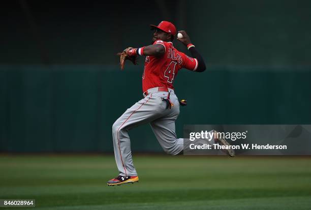 Brandon Phillips of the Los Angeles Angels of Anaheim leaps in the air to throw back to first base but not in time to get the runner against the...