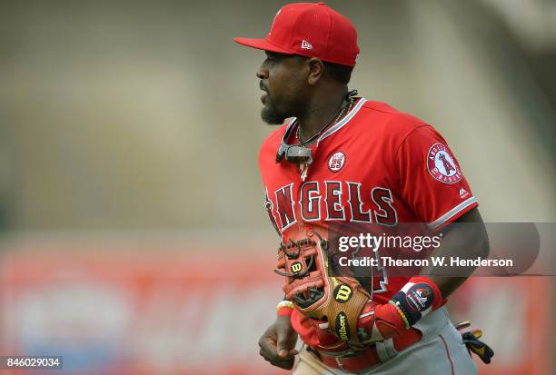 Brandon Phillips of the Los Angeles Angels of Anaheim looks on as he jogs off the field at the end of the seventh inning against the Oakland...