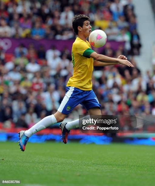 Oscar of Brazil in action during the Men's Football match between Brazil and Belarus on Day 2 of the London 2012 Olympic Games at Old Trafford on...