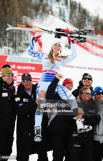 Lindsey Vonn of the United States of America celebrates with team mates after winning the Women's Super G event held on the Face de Solaise course on...