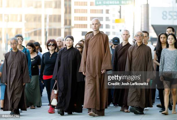 Brother Phap Luu and 50 of the Thich Nhat Hanh's global monastic community lead a silent peace walk at La Cienega Park before the 'Walk With Me'...