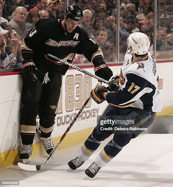 Marc-Andre Gragnani of the Buffalo Sabres checks Ryan Getzlaf of the Anaheim Ducks during the game on February 02, 2009 at Honda Center in Anaheim,...