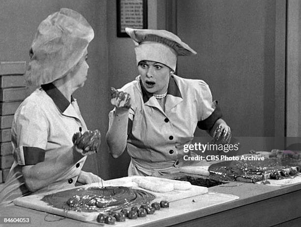 American actresses Amanda Milligan , as Candy Dipper, and Lucille Ball , as Lucy Ricardo, work side-by side in a candy factory on an episode of the...