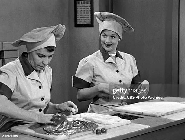 American actresses Amanda Milligan , as Candy Dipper, and Lucille Ball , as Lucy Ricardo, work side-by side in a candy factory on an episode of the...