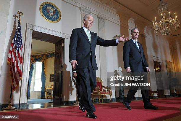 Vice President Joe Biden walks with US Senator Judd Gregg , R-NH, and US President Barack Obama to a press conference to announce the nomination of...