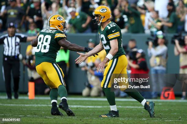 Ty Montgomery and Aaron Rodgers of the Green Bay Packers celebrate after scoring a touchdown in the third quarter against the Seattle Seahawks at...