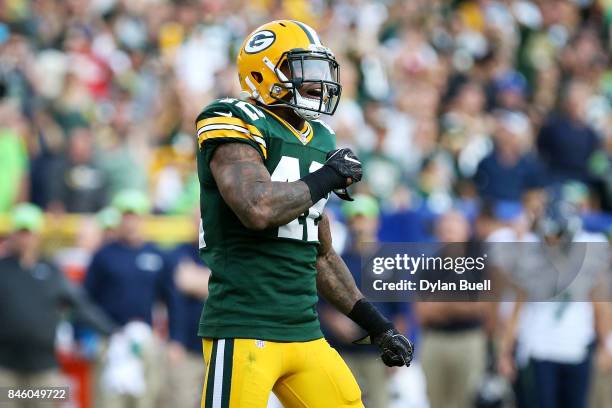 Morgan Burnett of the Green Bay Packers celebrates after making a tackle in the fourth quarter against the Seattle Seahawks at Lambeau Field on...
