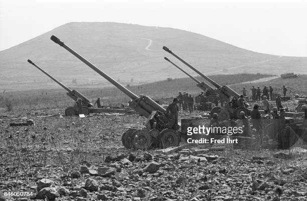 Israeli troops standing by with canons in the field on the Golan Heights during the Yom Kippur war.