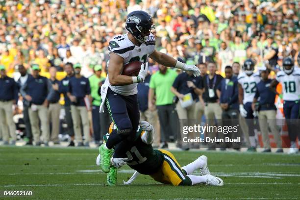 Ha Ha Clinton-Dix of the Green Bay Packers tackles Nick Vannett of the Seattle Seahawks in the third quarter at Lambeau Field on September 10, 2017...