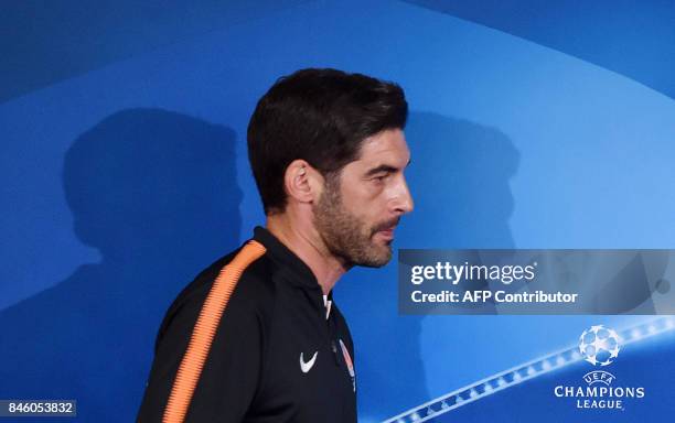 Shakhtars coach Paulo Fonseca arrives to address a press conference at The Metalist Stadium in Kharkiv on September 12 on the eve of the UEFA...