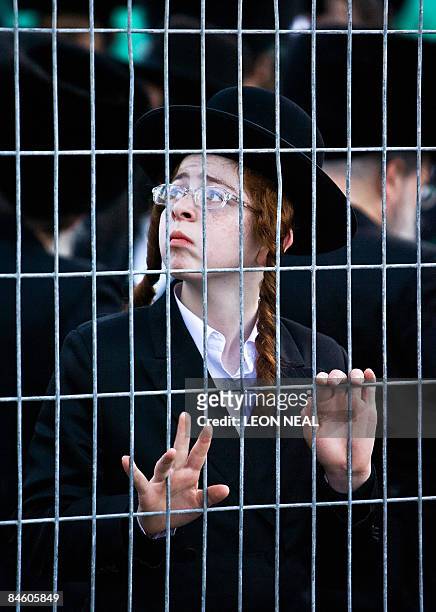 An ultra-Orthodox Jewish boy attends a religious Hasidic wedding celebration in the heart of Jerusalem on February 3, 2009. The Hasidic sect is a...