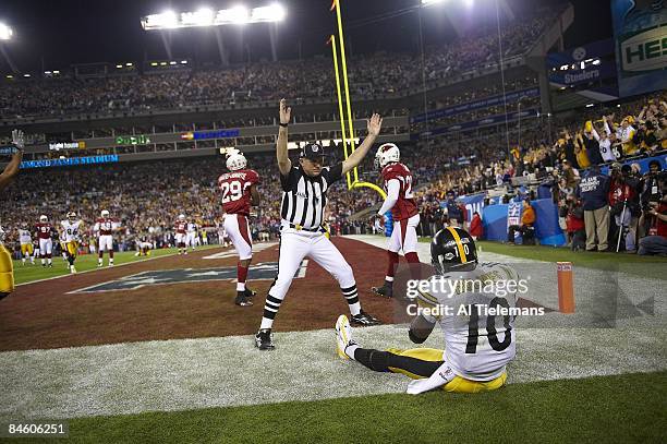 Super Bowl XLIII: Pittsburgh Steelers Santonio Holmes sitting out of bounds after making game winning touchdown catch vs Arizona Cardinals during 4th...