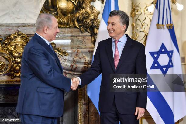 Israeli Prime Minister Benjamin Netanyahu and President of Argentina Mauricio Macri shake hands during a meeting as part of the official visit of...