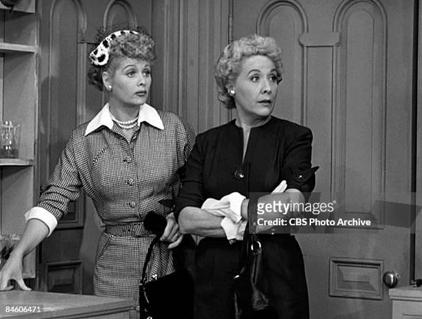 American comic actresses Lucille Ball , as Lucy Ricardo, and Vivian Vance , as Ethel Mertz, stand side by side in a scene from an episode of the...