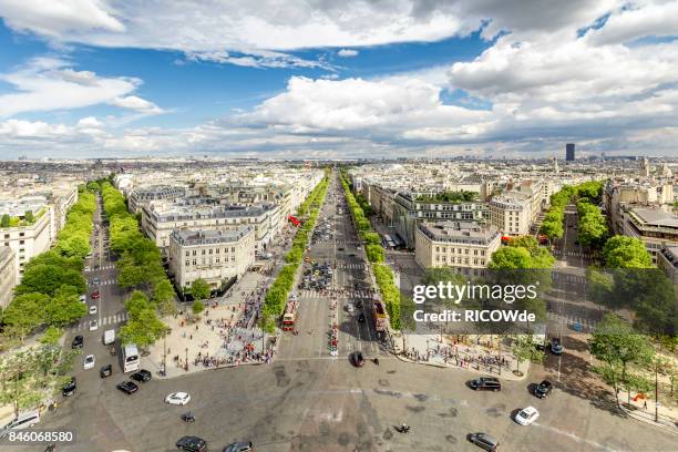 avenue des champs-élysées seen from the arc de triomphe - avenue des champs elysees stock pictures, royalty-free photos & images