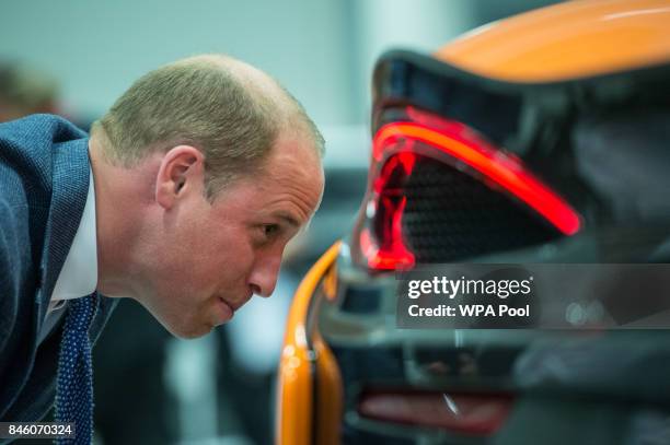 Prince William, Duke of Cambridge looks at a McLaren 720S under construction as he walks the factory floor during a visit to McLaren Automotive at...