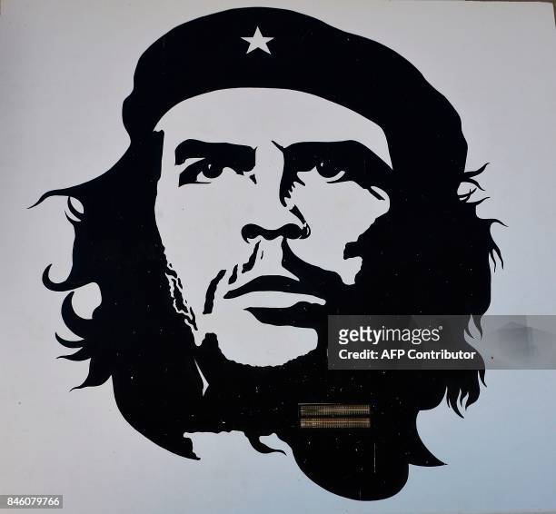Picture taken on September 8, 2017 shows a portrait of late Argentinian revolutionary legend Ernesto "Che" Guevara painted on an exterior wall of the...