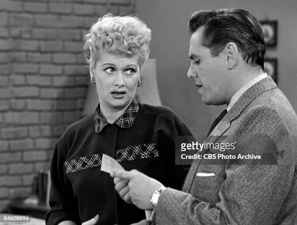 American comedienne and actress Lucille Ball , as Lucy Ricardo, listens to Cuban-born American actor and musician Desi Arnaz , as Ricky Ricardo,...