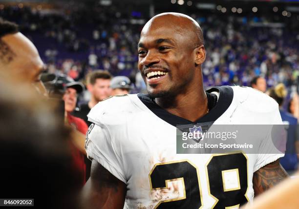 New Orleans Saints running back Adrian Peterson talks with Vikings players after a NFL game between the Minnesota Vikings and New Orleans Saints on...