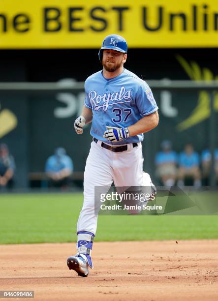 Brandon Moss of the Kansas City Royals rounds the bases after hitting a grand slam home run during the 1st inning of the game against the Chicago...
