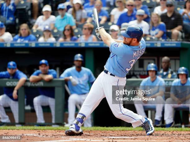 Brandon Moss of the Kansas City Royals hits a grand slam home run during the 1st inning of the game against the Chicago White Sox at Kauffman Stadium...