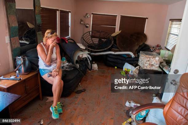 Patty Purdo surveys the damage caused to her trailer home from Hurricane Irma at the Seabreeze Trailer Park in Islamorada, in the Florida Keys,...