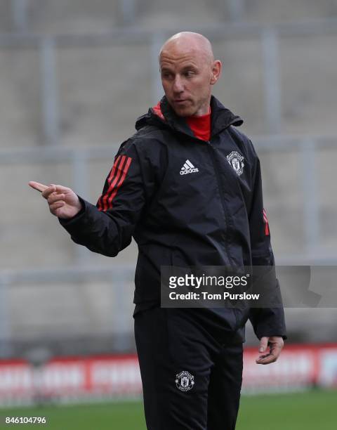 Manager Nicky Butt of Manchester United U19s watches from the touchline during the UEFA Youth League match between Manchester United U19s and FC...