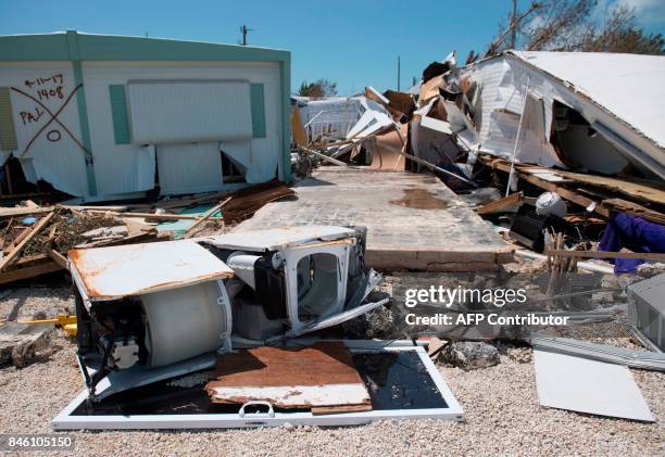 Debris from trailer homes destroyed by Hurricane Irma litters the Seabreeze Trailer Park in Islamorada, in the Florida Keys, September 12, 2017. /...